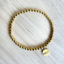 Load image into Gallery viewer, 18k gold plated beads on a durable stretch cord creates a comfortable bracelet that is perfect for stacking