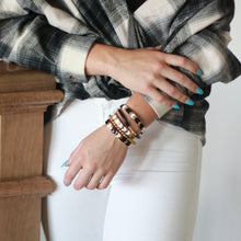 Load image into Gallery viewer, Gold black white chevron beaded stretch bracelet on wrist