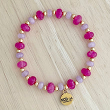 Load image into Gallery viewer, Beaded bracelet with pink, gold, and purple beads on a light wooden surface