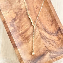 Load image into Gallery viewer, Gold lariat necklace worn with layered chains