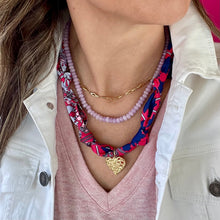 Load image into Gallery viewer, Lavender beaded necklace layered with other gold necklaces and a satin scarf necklace
