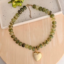 Load image into Gallery viewer, Chunky olive green necklace is perfect to add a pop of color to your fall outfit. The gold heart charm is removable allowing 2 different looks