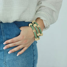 Load image into Gallery viewer, olive green and wooden bead bracelet stack creates interesting texture