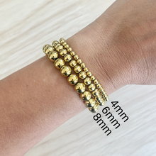 Load image into Gallery viewer, 18k gold plated beads on a durable stretch cord creates a comfortable bracelet that is perfect for stacking
