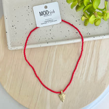 Load image into Gallery viewer, Kansas City Chiefs must have game day accessory; this cute red beaded necklace with gold arrowhead charm