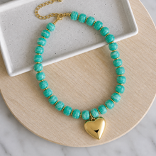 Load image into Gallery viewer, Colorful resin bead statement necklace with removable large gold heart charm and tarnish resistant clasp makes a perfect gift or accessory for date night
