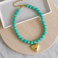 Colorful resin bead statement necklace with removable large gold heart charm and tarnish resistant clasp makes a perfect gift or accessory for date night
