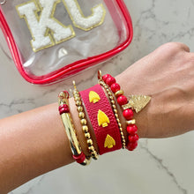 Load image into Gallery viewer, Beaded arrowhead bracelet stacked with gold bracelets
