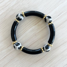 Load image into Gallery viewer, Black and neutral gemstone bracelet stacked on wrist
