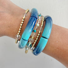 Load image into Gallery viewer, Blue ombre bracelet layered with gold bracelets coastal look
