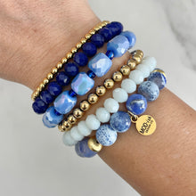Load image into Gallery viewer, Sodalite natural gemstone bracelet stacked with other blue and white bracelets perfect for everyday wear.

