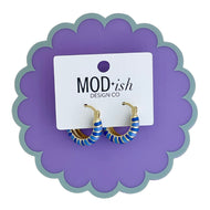 Blue enamel stripes on gold hoop earrings make a statement for an every day outfit or perfect for game day