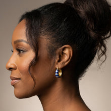 Load image into Gallery viewer, Woman wearing blue stripe enamel and gold hoop earring 
