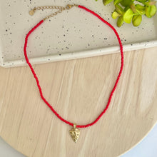 Load image into Gallery viewer, Kansas City Chiefs must have game day accessory; this cute red beaded necklace with gold arrowhead charm
