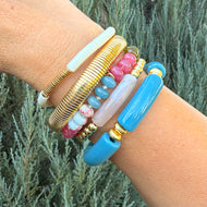 Bracelet stack of 5 stretchy bracelets featuring colorful gemstone beads, neutral, muted colors, and gold plated beads.  A great stack for fall.