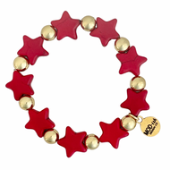 A red and gold beaded bracelet with star-shaped howlite beads and gold-plated beads on an elastic cord, branded with a small gold tag with the name 'Howlite'.