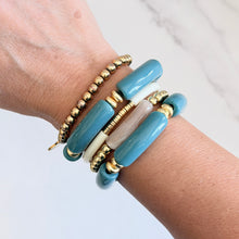 Load image into Gallery viewer, Muted turquoise acrylic tube beads separated by textured gold-plated rondelle beads sourced from India create a gorgous bracelet that adds a pop of color to your stack
