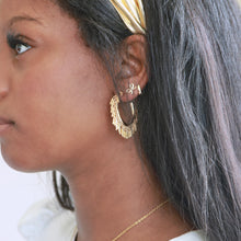 Load image into Gallery viewer, Lightweight hypoallergenic gold hoop earrings on model
