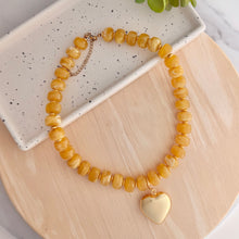 Load image into Gallery viewer, Chunky resin bead necklace in a golden yellow color is perfect for fall outfits and Kansas City Chiefs game day looks
