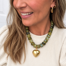 Load image into Gallery viewer, Chunky olive green beaded necklace is perfect to add a pop of color to your fall outfit.  The gold heart charm is removable allowing 2 different looks
