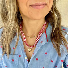 Load image into Gallery viewer, Red gingham bandana necklace layered with gold chains
