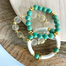 Load image into Gallery viewer, Turquoise bracelet stacked with gold bracelets
