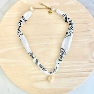 White bandana necklace with statement charm