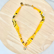 Yellow bandana necklace with statement charm