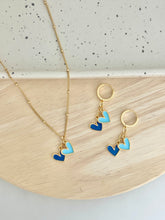 Load image into Gallery viewer, gold plated huggie hoop earrings with a royal blue and light blue enamel heart charms are perfect for Kansas City Royals games or as a gift.  Matching necklace available. 
