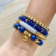 Load image into Gallery viewer, royal blue, white, and gold bracelet stack featuring glass, howlite and gold plated beads
