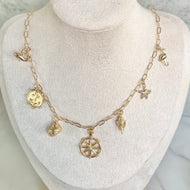 Gold sea life charm necklace ocean inspired jewelry