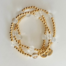 Load image into Gallery viewer, 18k gold plated beads are hypoallergenic and perfect for stacking.  Clear quartz beads add texture and interest in this unique handmade bracelet
