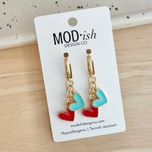 Load image into Gallery viewer, gold plated huggie hoop earrings with a red and teal enamel heart charm are perfect for Kansas City women's soccer games to support the KC Current

