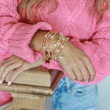 Load image into Gallery viewer, a stack full of 18k gold plated beads are hypoallergenic and perfect for stacking.  Clear quartz beads add texture and interest in this unique handmade bracelet
