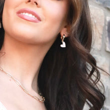 Load image into Gallery viewer, gold huggie earrings with black heart charm minimalist jewelry
